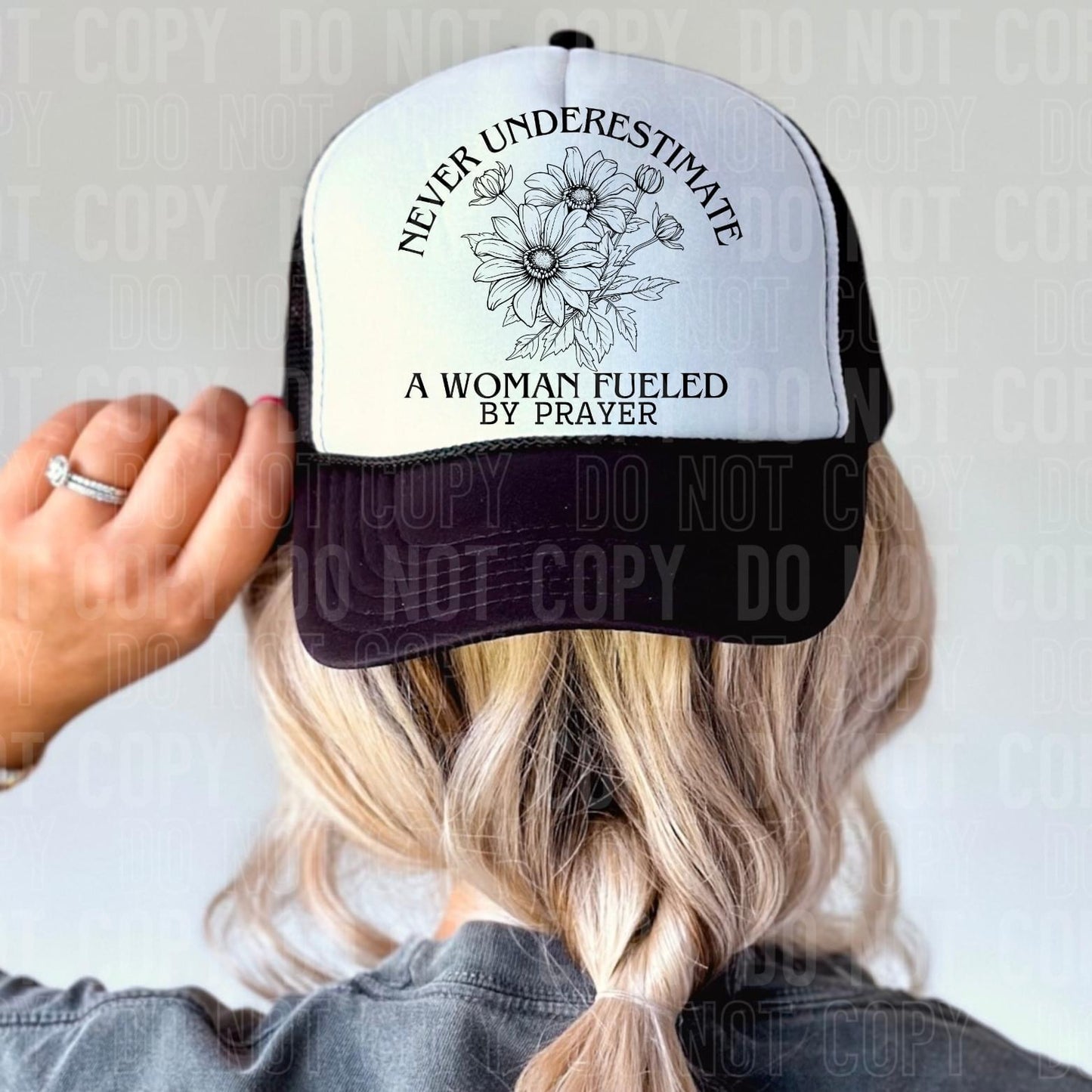 Never Underestimate a Woman Fueled by Prayer Trucker Hat